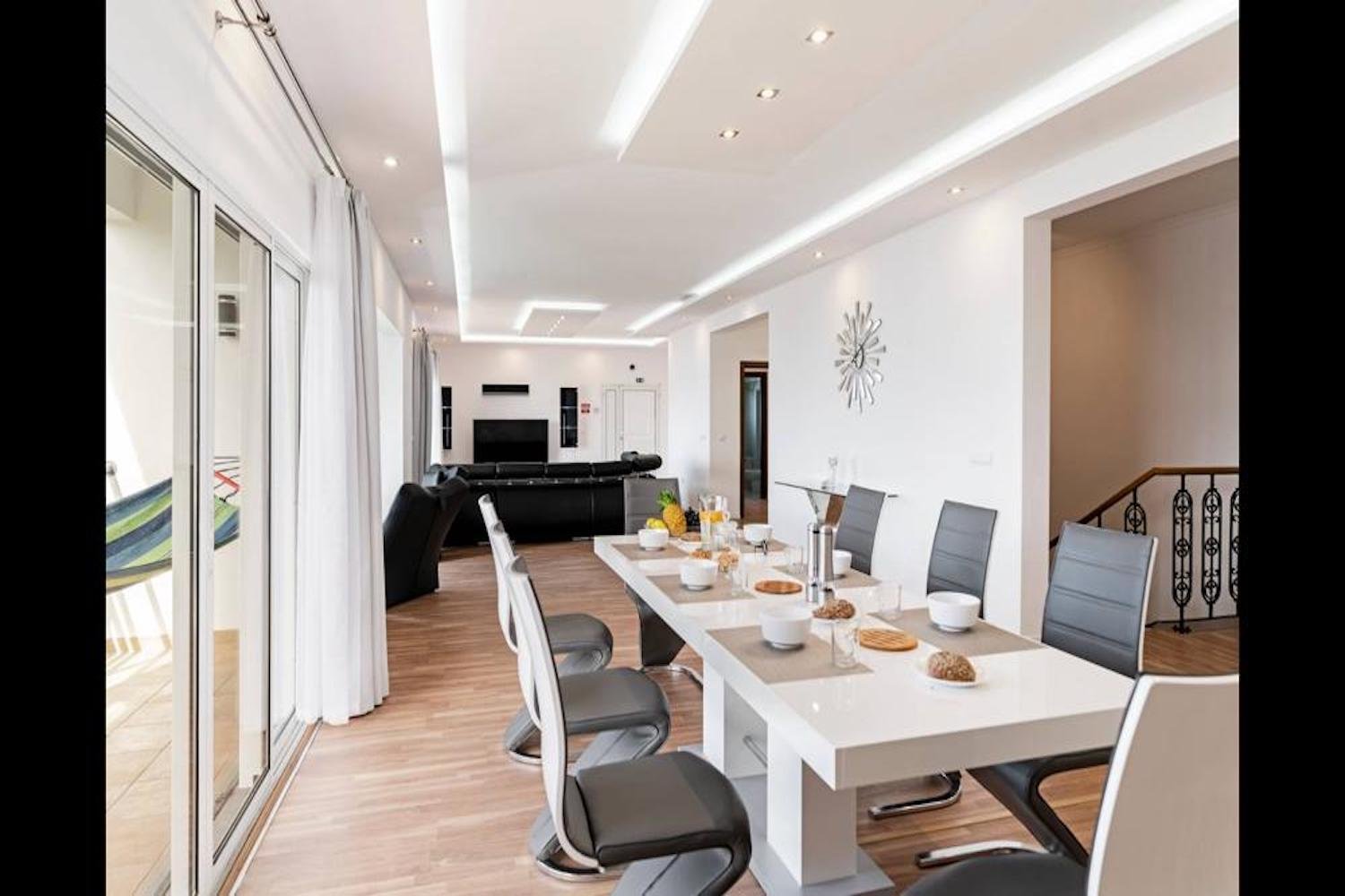 Dining room and Lounge with with table an chairs and sofa