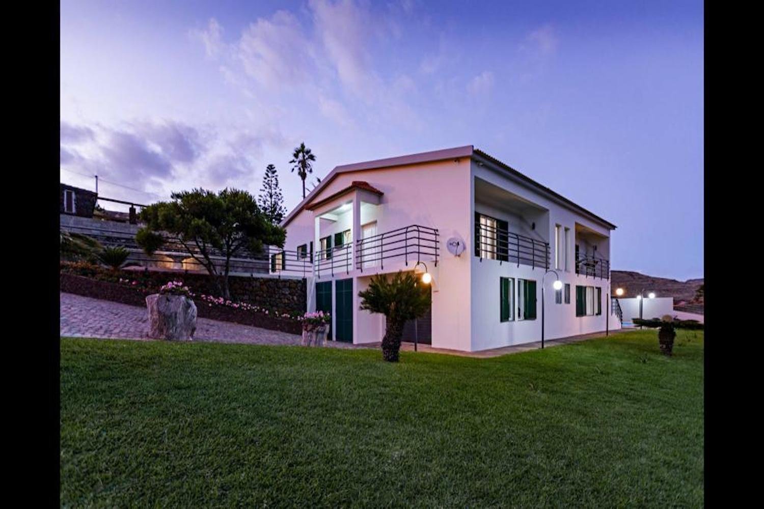 Front facade of the house in the evening