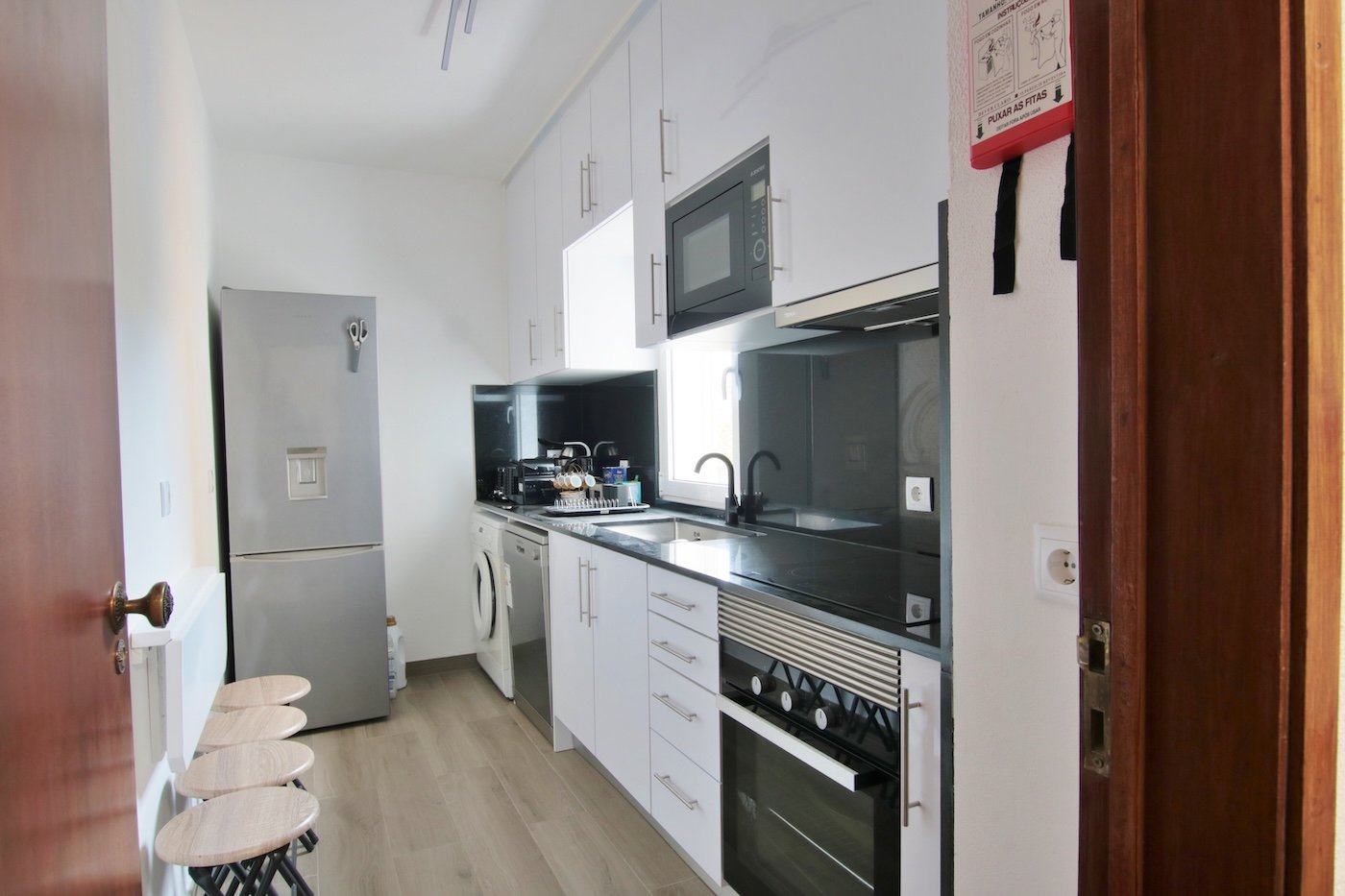Kitchen with fridge whashing machine and dishwasher and oven-1