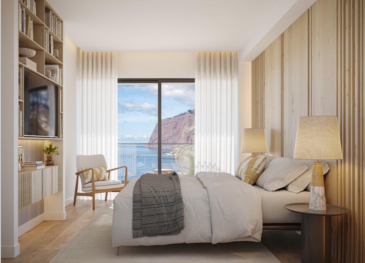 Bedroom with double bed and sea view