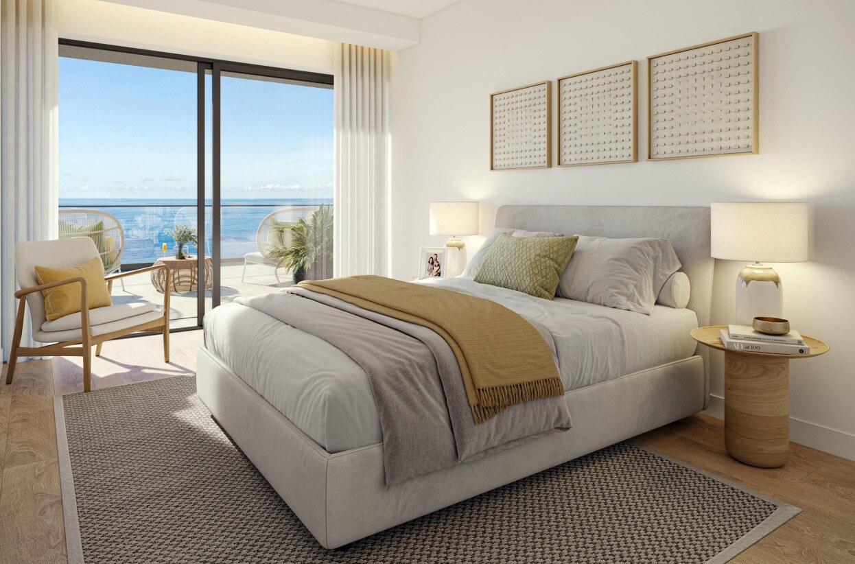 Bedroom with double bed and sea view