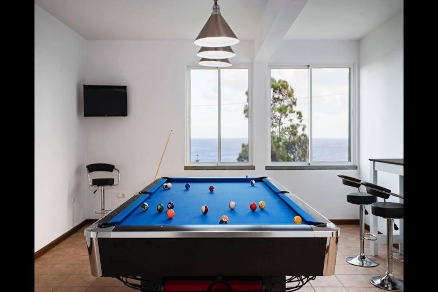 Room with a Snooker table and a sea view from the windows