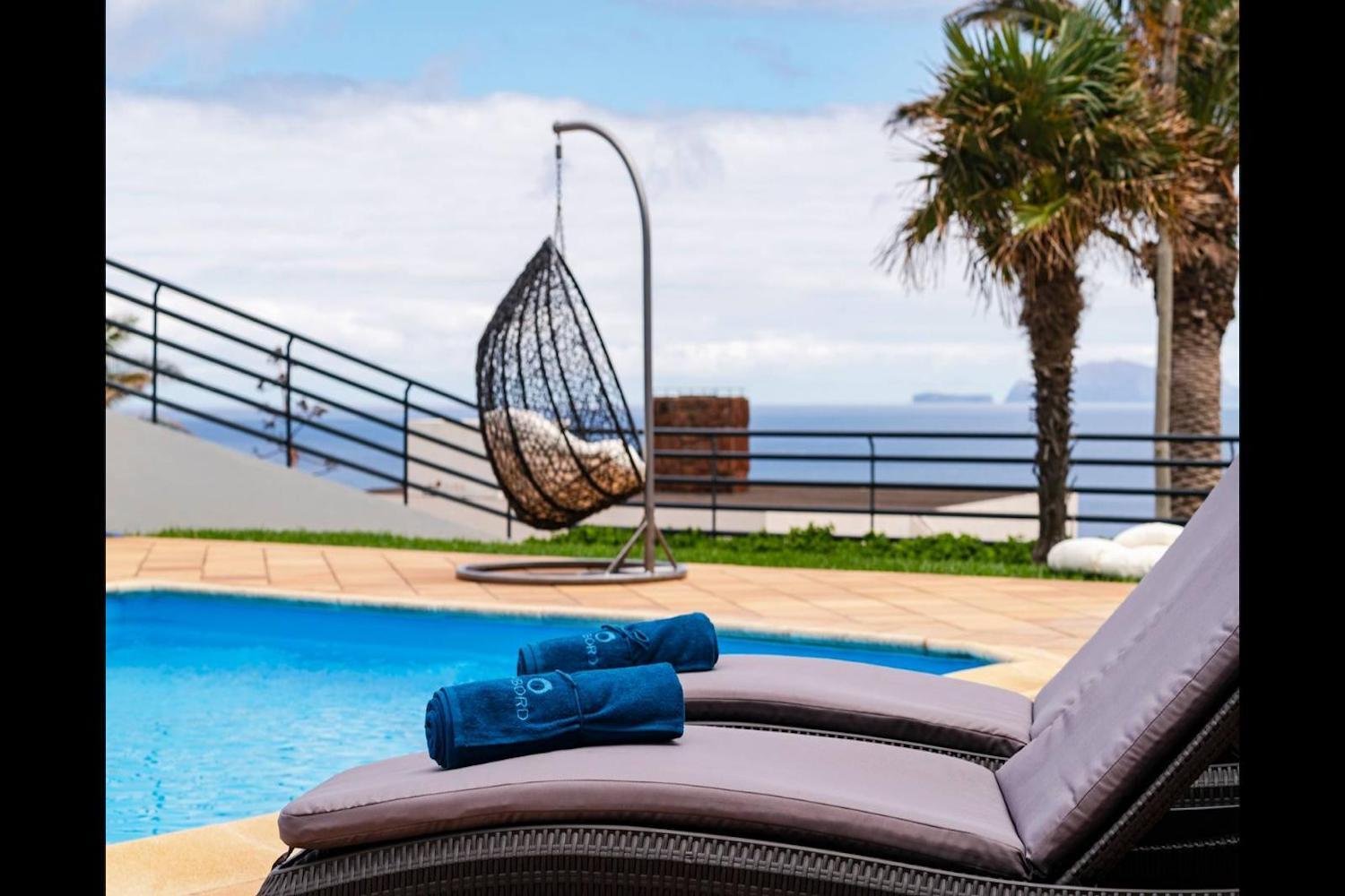 Swimming pool area with sunloungers