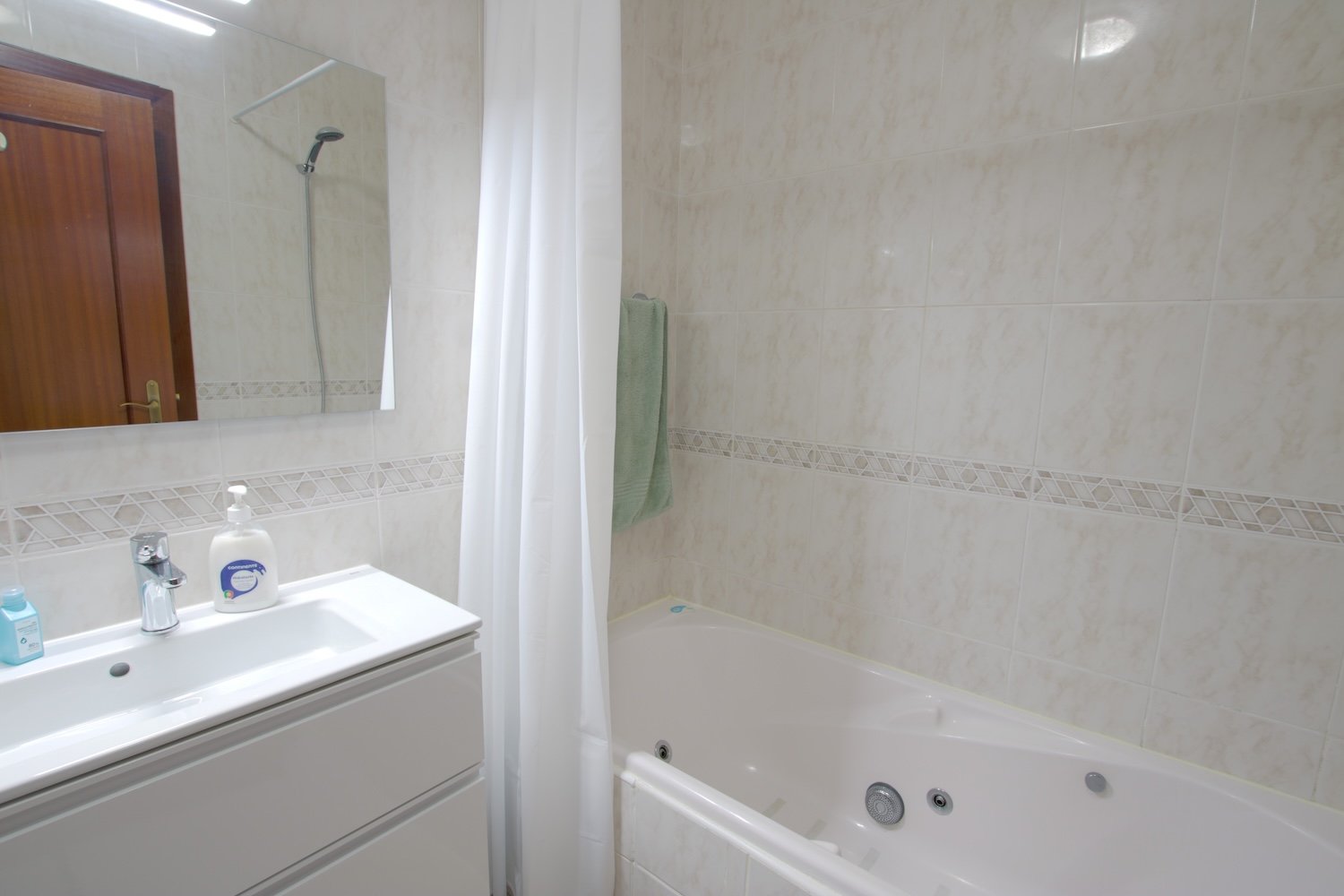 The bathroom with basin and bathtub