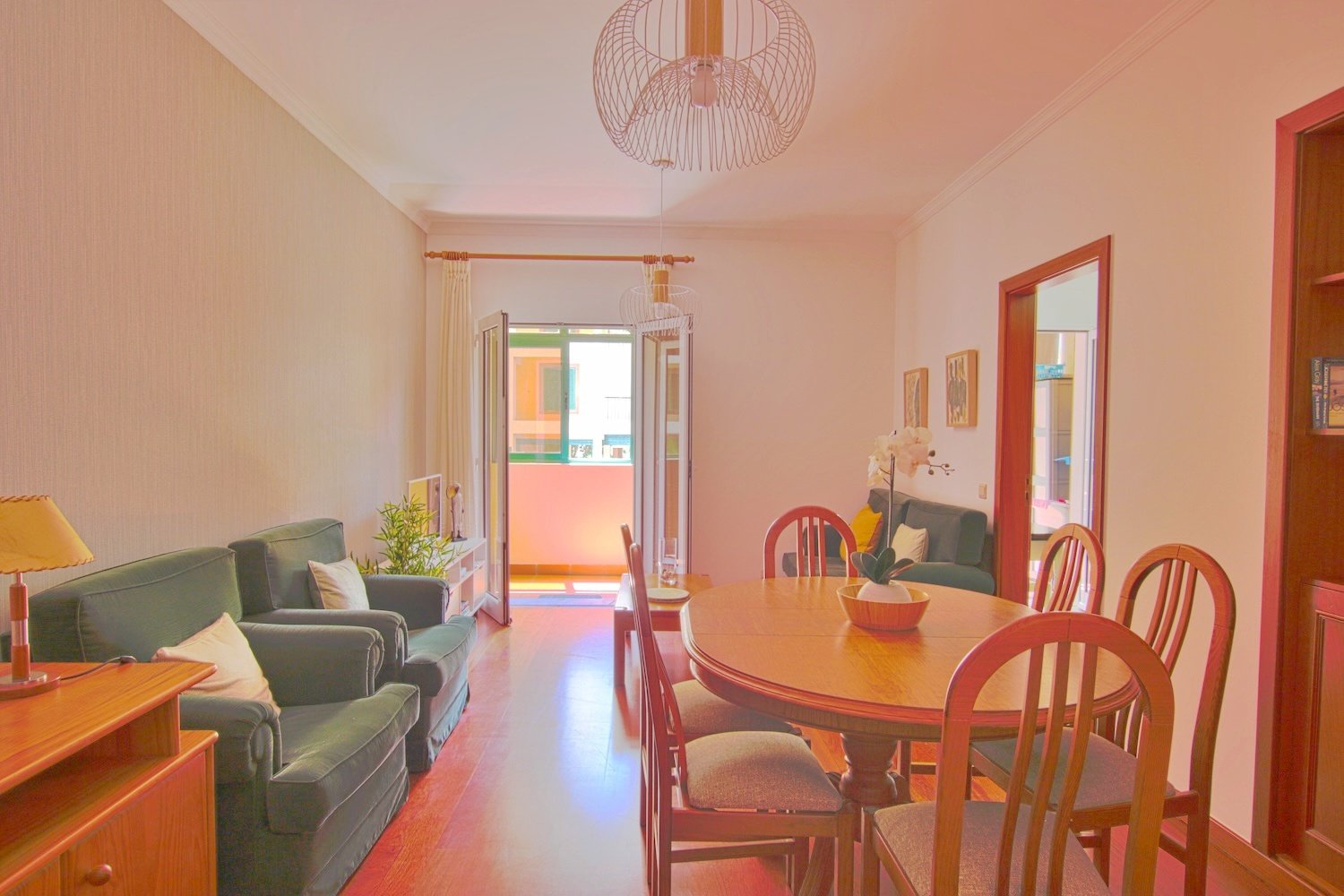 The living room with, two armchairs a sofa and dining table