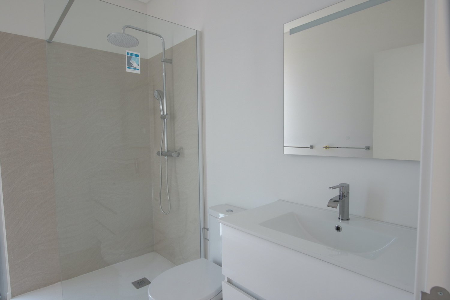 Bathroom with hand basin and shower