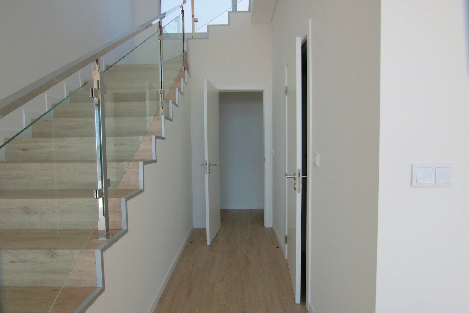 Stairway with storeroom entrance next to it