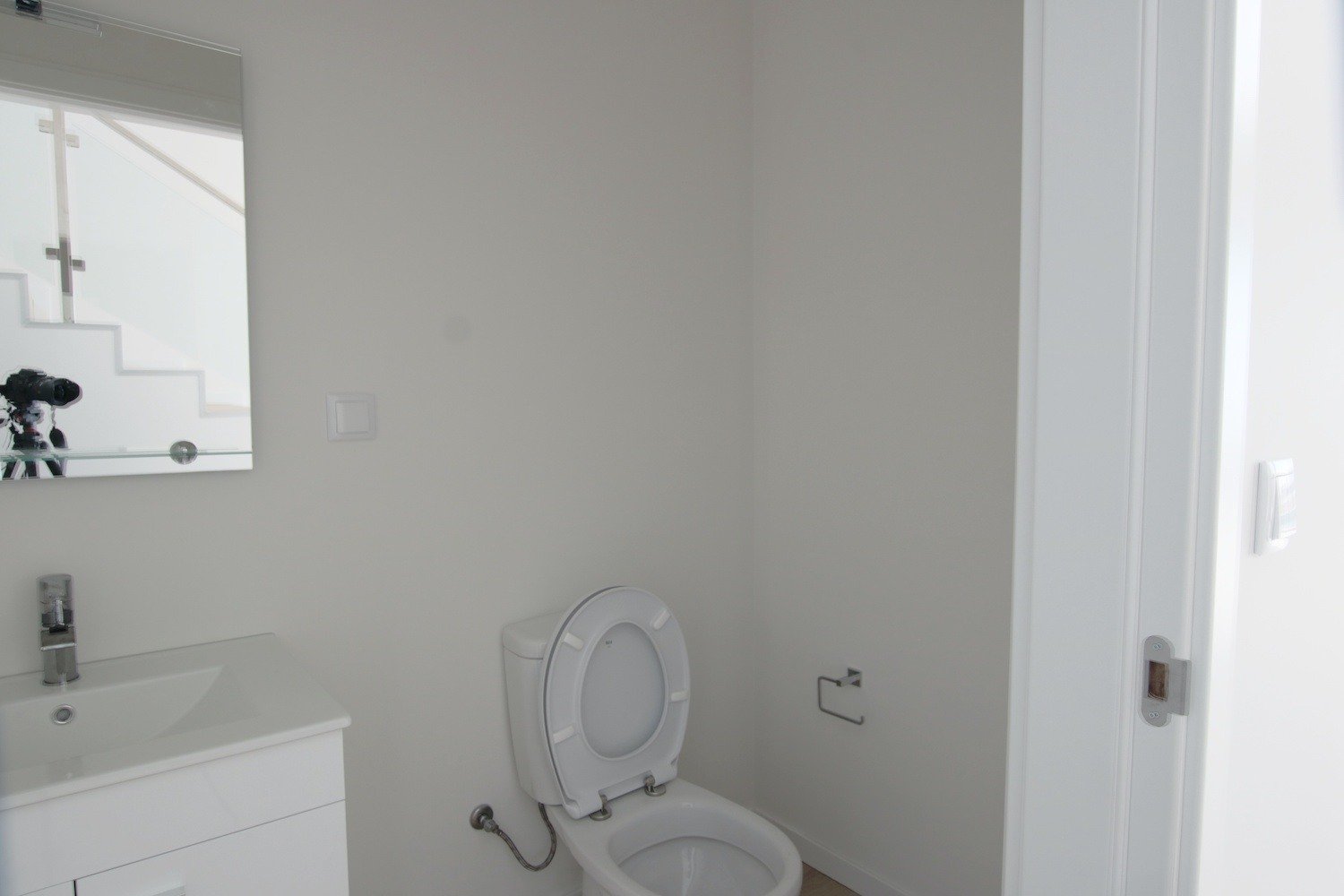 Bathroom with hand basin and toilet seat