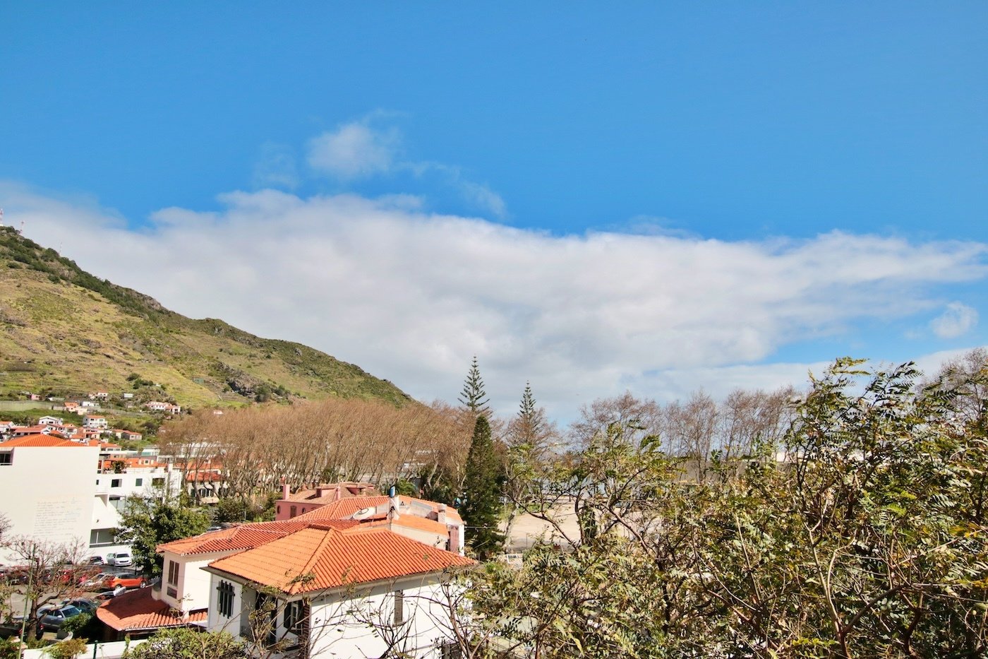 View from bedroom with surrounding properties and mountain view