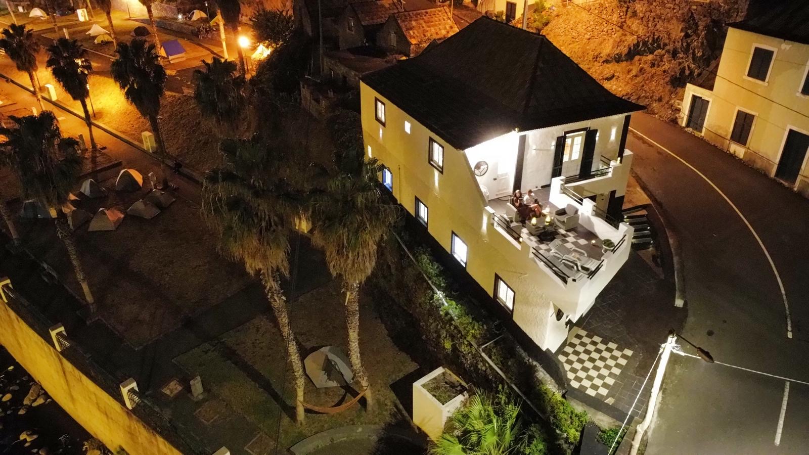 Night time birds eye view of the property